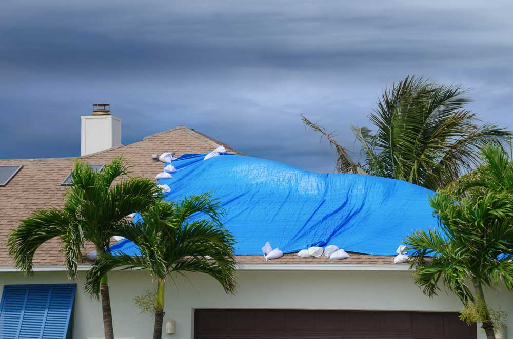 Tarp on a roof blowing in the wind